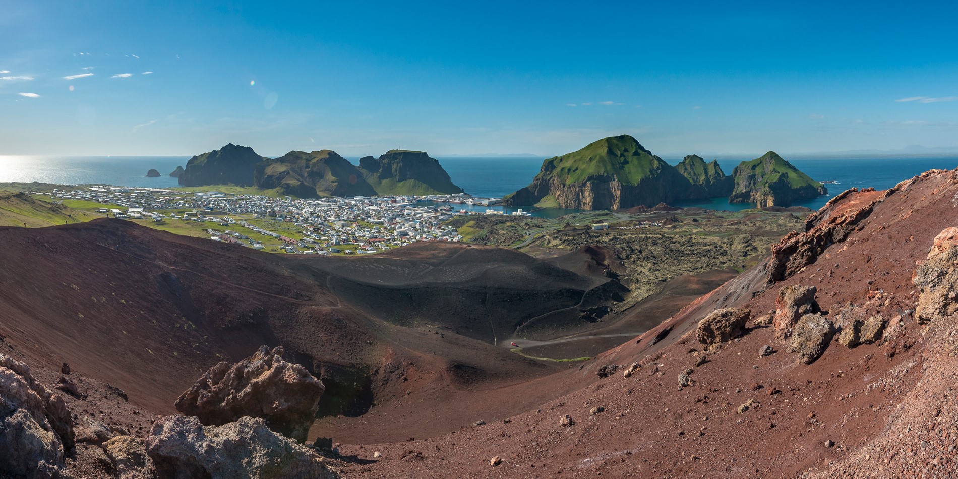 Heimaey, Iceland, View from Eldfell volcano. Small town next to the Sea with small but high Islands.