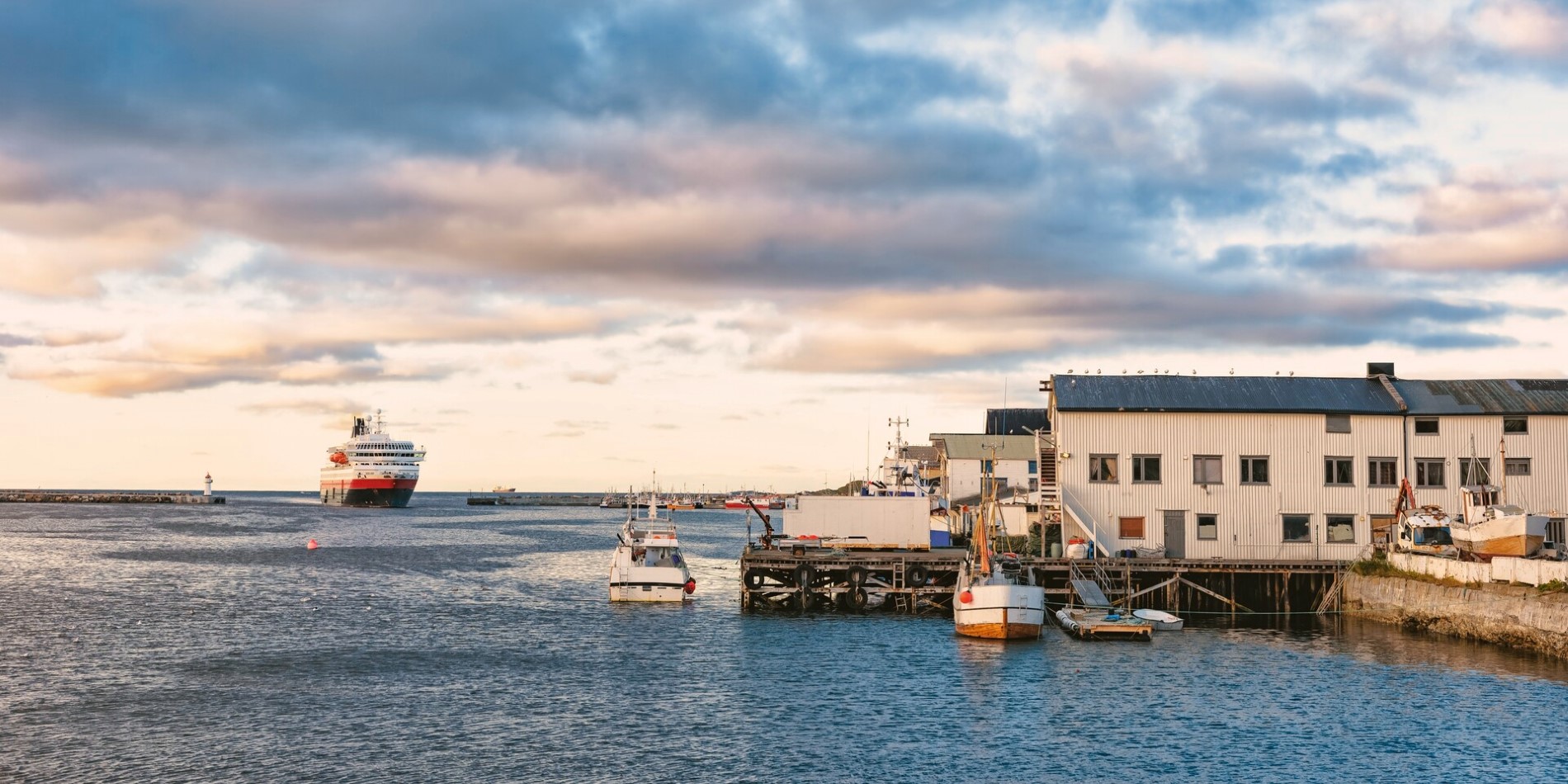 A Hurtigruten ship pulling into the port of Vardø